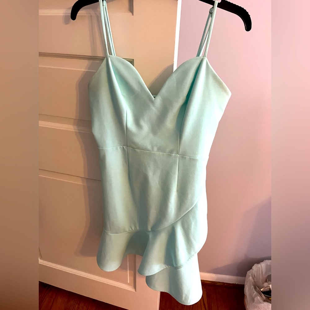 Teal dress with ruffle.
